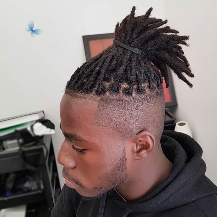 Shaved Sides with Dreadlock top knot Men Hairstyle